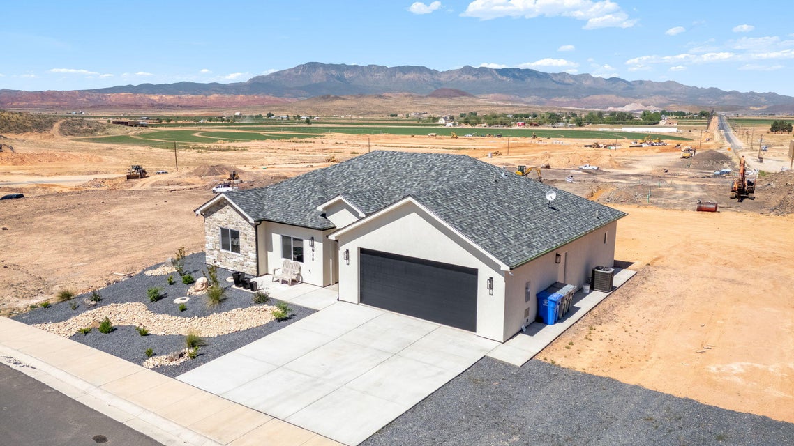 View of subject property featuring a mountain backdrop