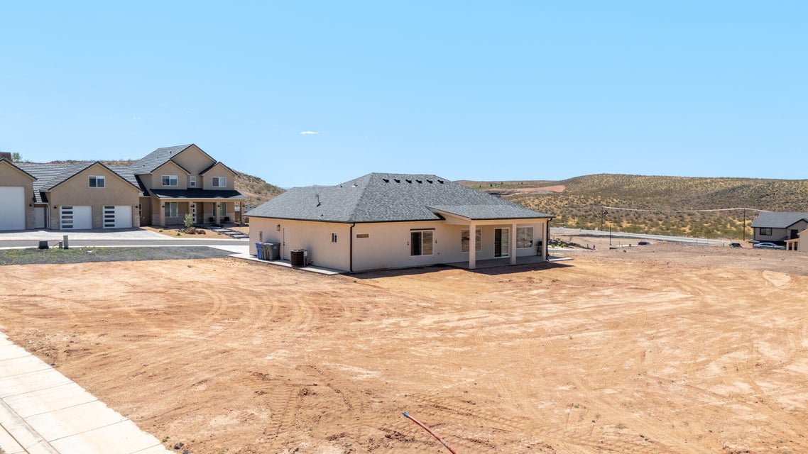 View of property exterior featuring a patio and a cooling unit
