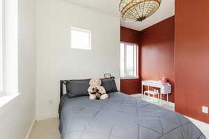 Bedroom with carpet floors and baseboards