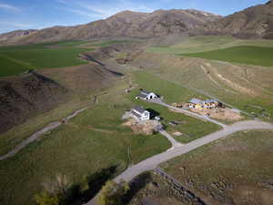 Aerial overview of property's location featuring rural landscape and a mountain backdrop