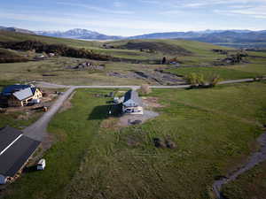 View of rural area with agricultural land and mountains