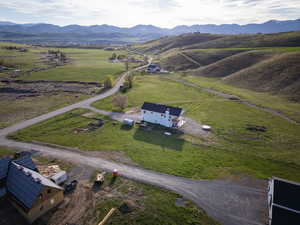 Aerial view of sparsely populated area with a mountainous background
