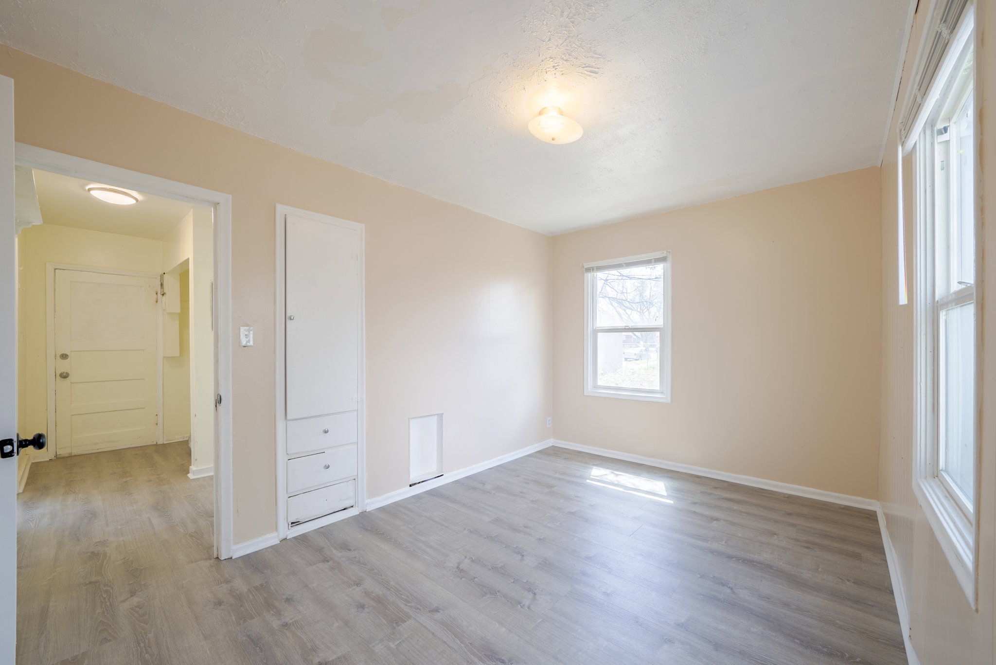 Unfurnished bedroom featuring light wood-style flooring
