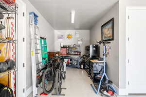 Garage featuring baseboards