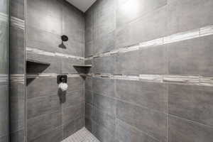 Bathroom featuring tiled shower