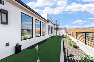 View of yard featuring a putting area and a patio area