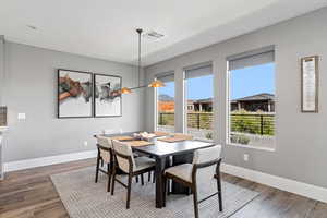Dining room featuring wood finished floors