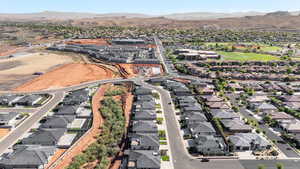 Aerial overview of property's location with mountains and nearby suburban area