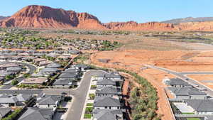 Aerial view of residential area featuring a mountain backdrop