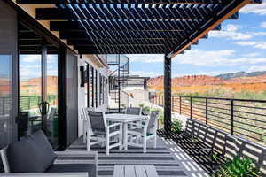 View of patio / terrace with a pergola, outdoor dining space, and a mountain view