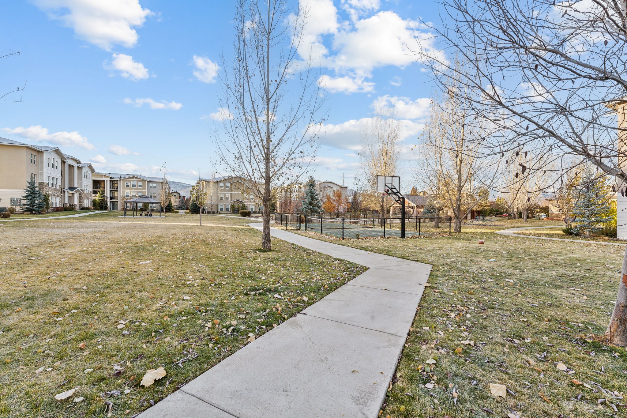 View of home's community featuring a residential view and community basketball court