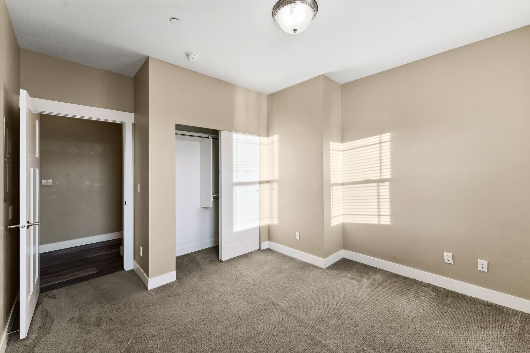 Unfurnished bedroom with a closet and carpet floors