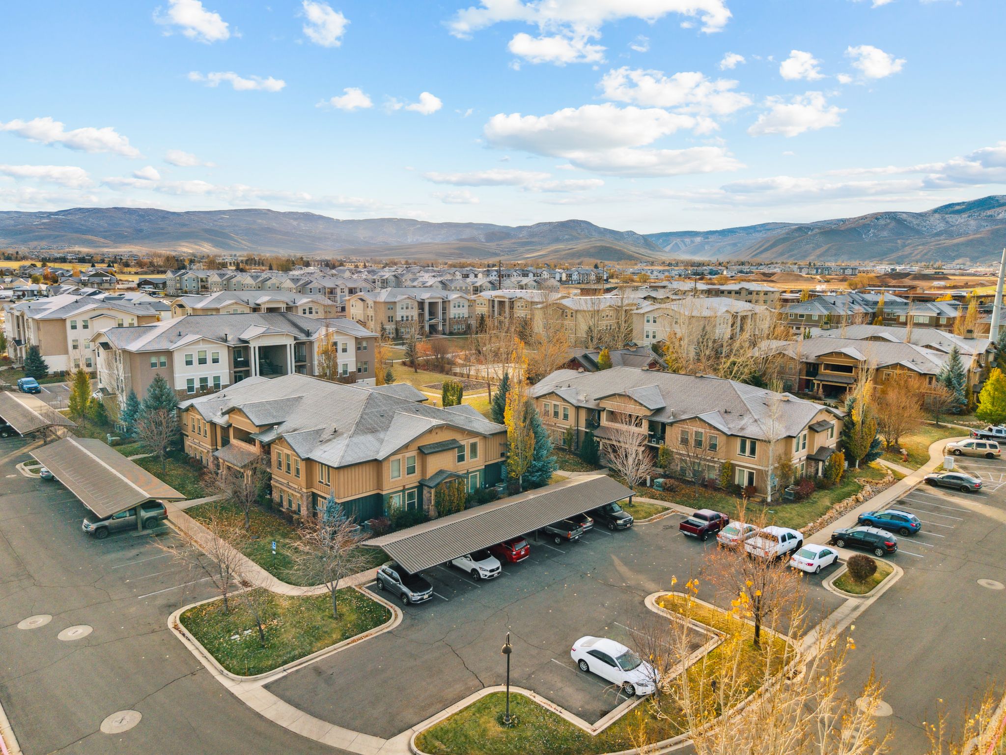 Aerial perspective of suburban area with a mountainous background