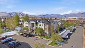 Aerial perspective of suburban area with a mountainous background