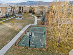 View of home's community with a mountain view, community basketball court, and a residential view