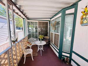 Sunroom / solarium with vaulted ceiling