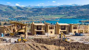 View of front facade featuring a patio area and a water and mountain view