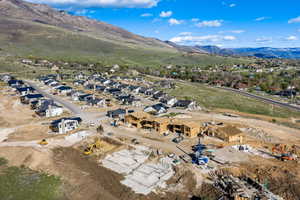 Aerial perspective of suburban area featuring a mountainous background