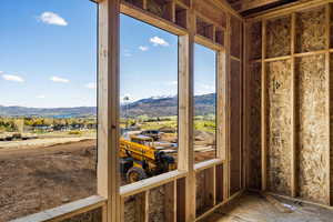 Sunroom / solarium with a mountain view and a residential view