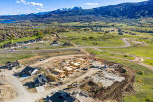 Aerial view of residential area featuring a mountainous background