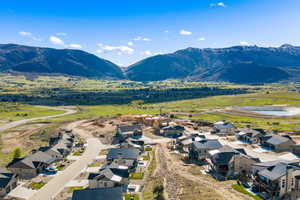 Aerial perspective of suburban area with a mountainous background