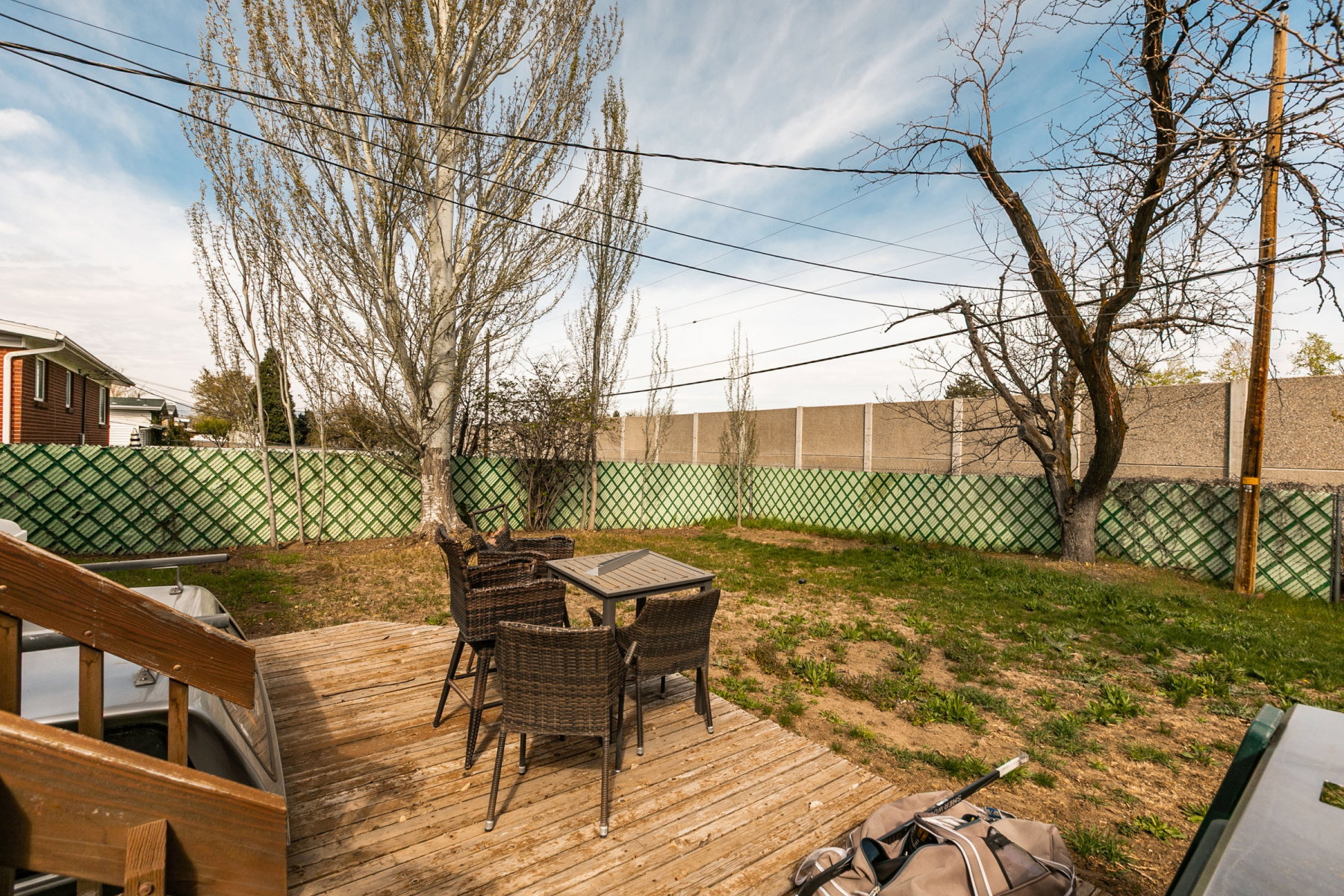 Deck featuring outdoor dining area and a fenced backyard