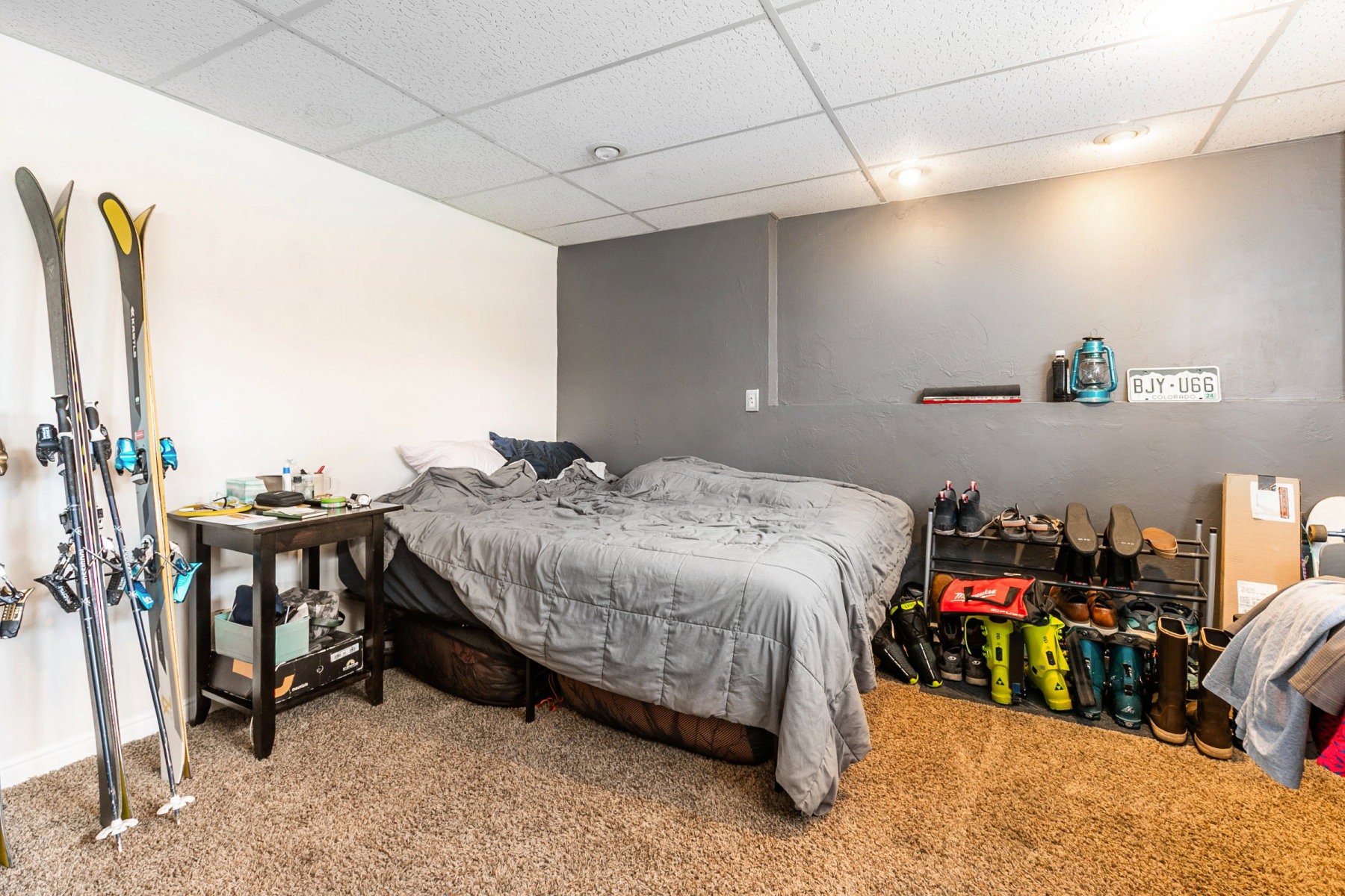 Bedroom featuring a drop ceiling and carpet flooring