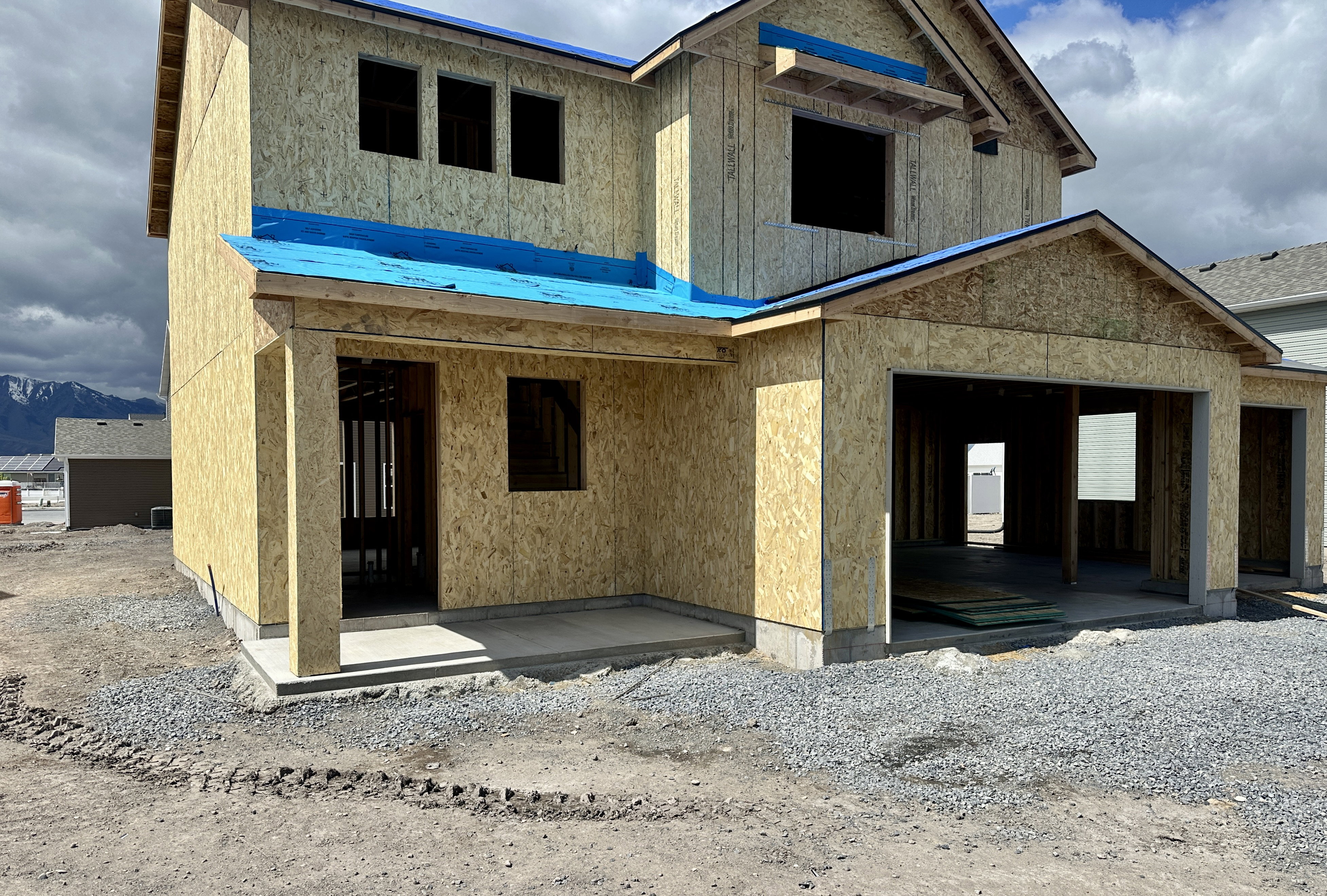 Property in mid-construction with a patio and a mountain view