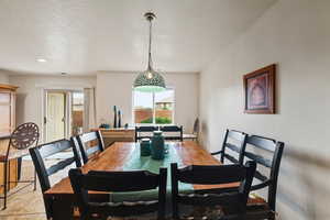 Dining area with a textured ceiling