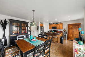 Dining room with recessed lighting and light tile patterned floors