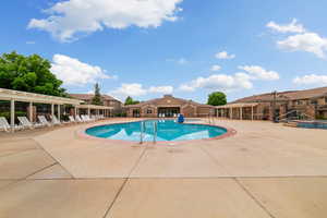 Community pool with a patio area