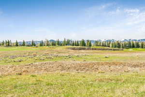 View of nature featuring a mountain backdrop and rural landscape