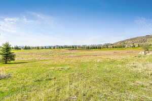 View of yard with a mountain view and a view of countryside