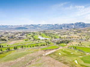 Bird's eye view of a water and mountain view and a golf club