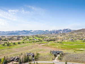 Mountain view with a golf course and nearby suburban area