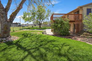 Fenced yard with a patio and a deck