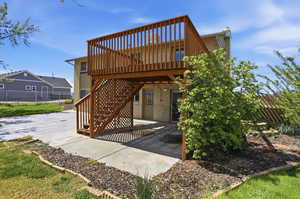 Back of house with a patio and a chimney