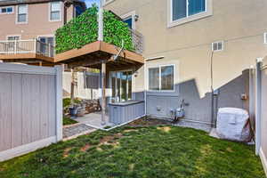 Back of house featuring stucco siding and a patio
