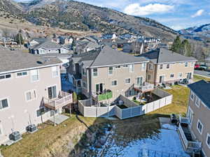 Aerial perspective of suburban area with a mountainous background