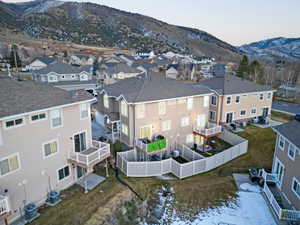 Aerial perspective of suburban area featuring a mountain backdrop