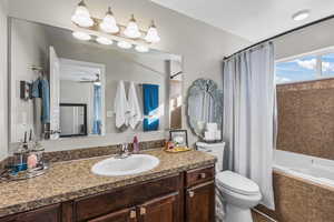 Bathroom with vanity and tiled shower / bath