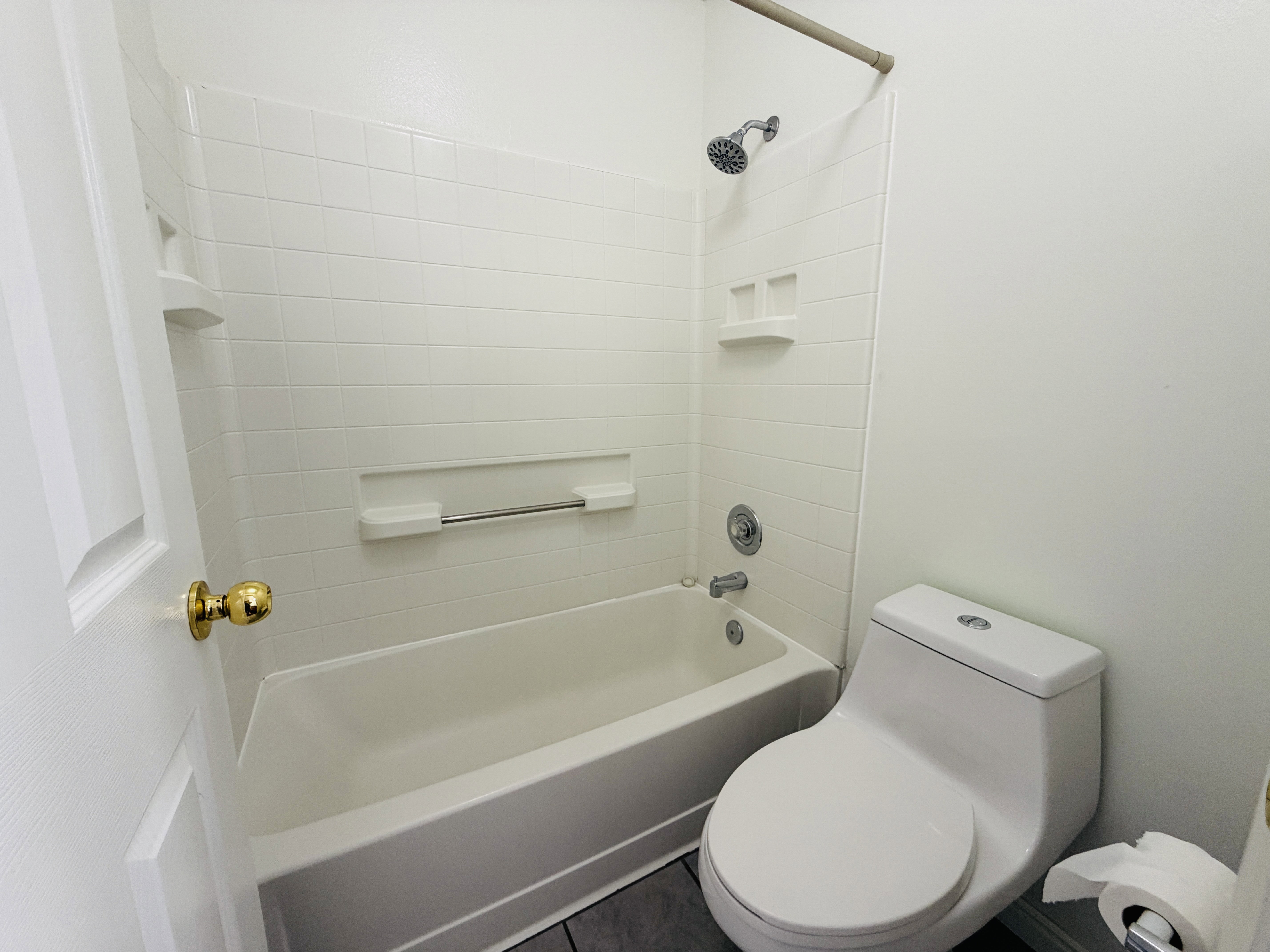 Full bath with toilet and shower / bath combination