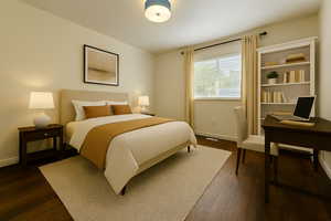 Bedroom with dark wood-style floors and an office area