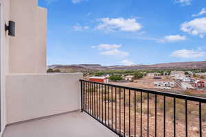 Balcony featuring a mountain view and a residential view