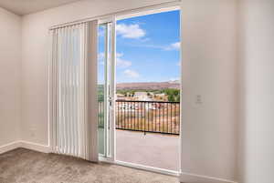 Entryway featuring carpet flooring and a residential view
