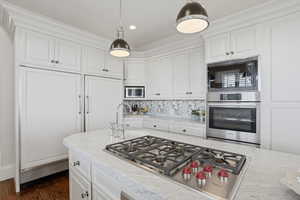 Updated kitchen with Carrara marble, new Wolf range, natural light
