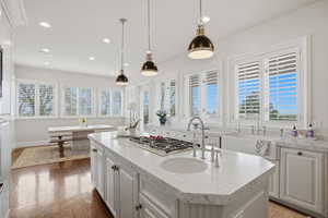 Updated kitchen with Carrara marble, new Wolf range, natural light