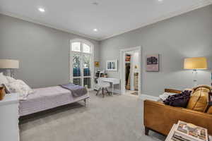 Main level bedroom with walk-in closet and ensuite bathroom