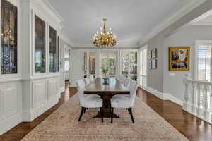 Formal dining room with custom cabinetry and crown molding