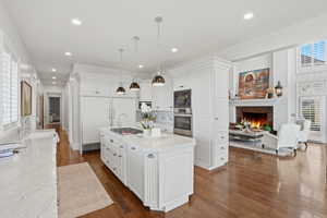Updated kitchen with Carrara marble, new Wolf range, natural light
